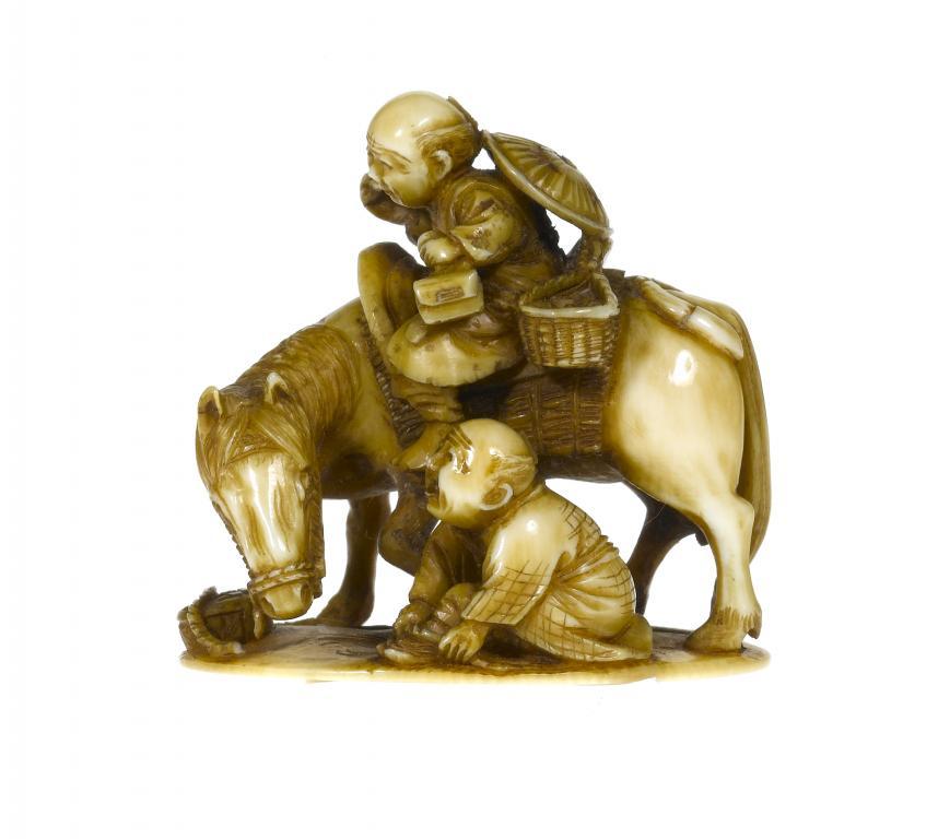 A JAPANESE IVORY OKIMONO  of a