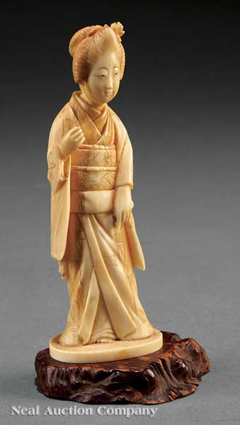 A Japanese Ivory Okimono of a