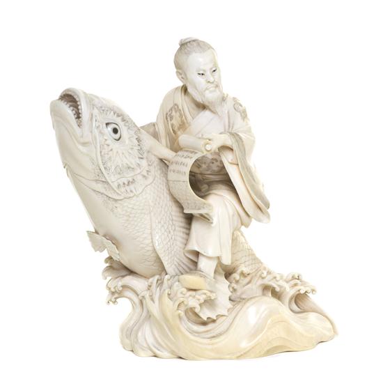 A Japanese Ivory Okimono of Kinko