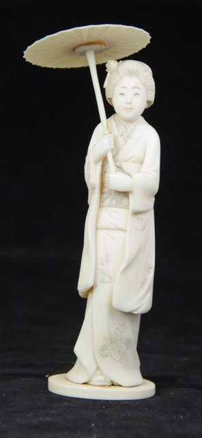 A Japanese ivory okimono of a