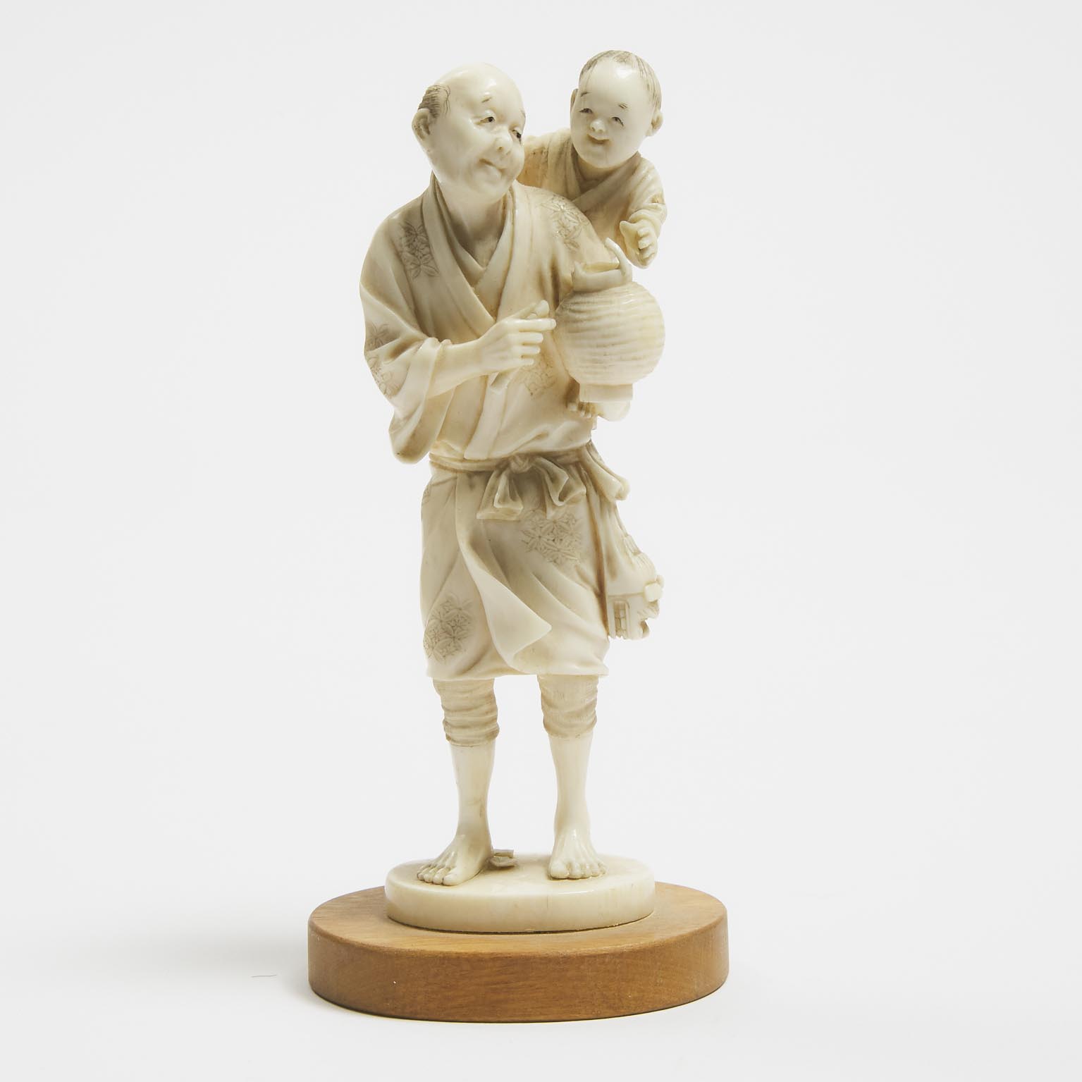 A Japanese Ivory Okimono of a Man