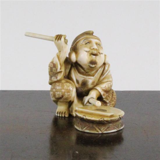 A Japanese ivory seated figure of a