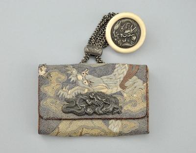 A Japanese Kagamibuta Netsuke and