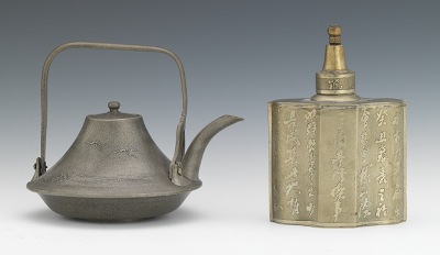 A Japanese Metal Tea Kettle and Tea