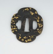 A Japanese Mixed Metals Tsuba