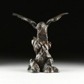 A JAPANESE PATINATED BRONZE FI