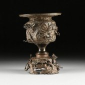 A JAPANESE PATINATED BRONZE "R