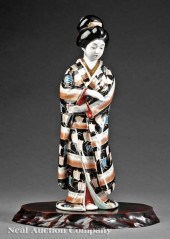 A Japanese Porcelain Figure of