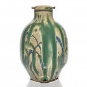 A JAPANESE POTTERY SAKE VESSEL