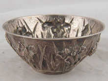A Japanese silver bowl heavily