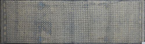 A JAVANESE GILT BLUE COTTON BATIK