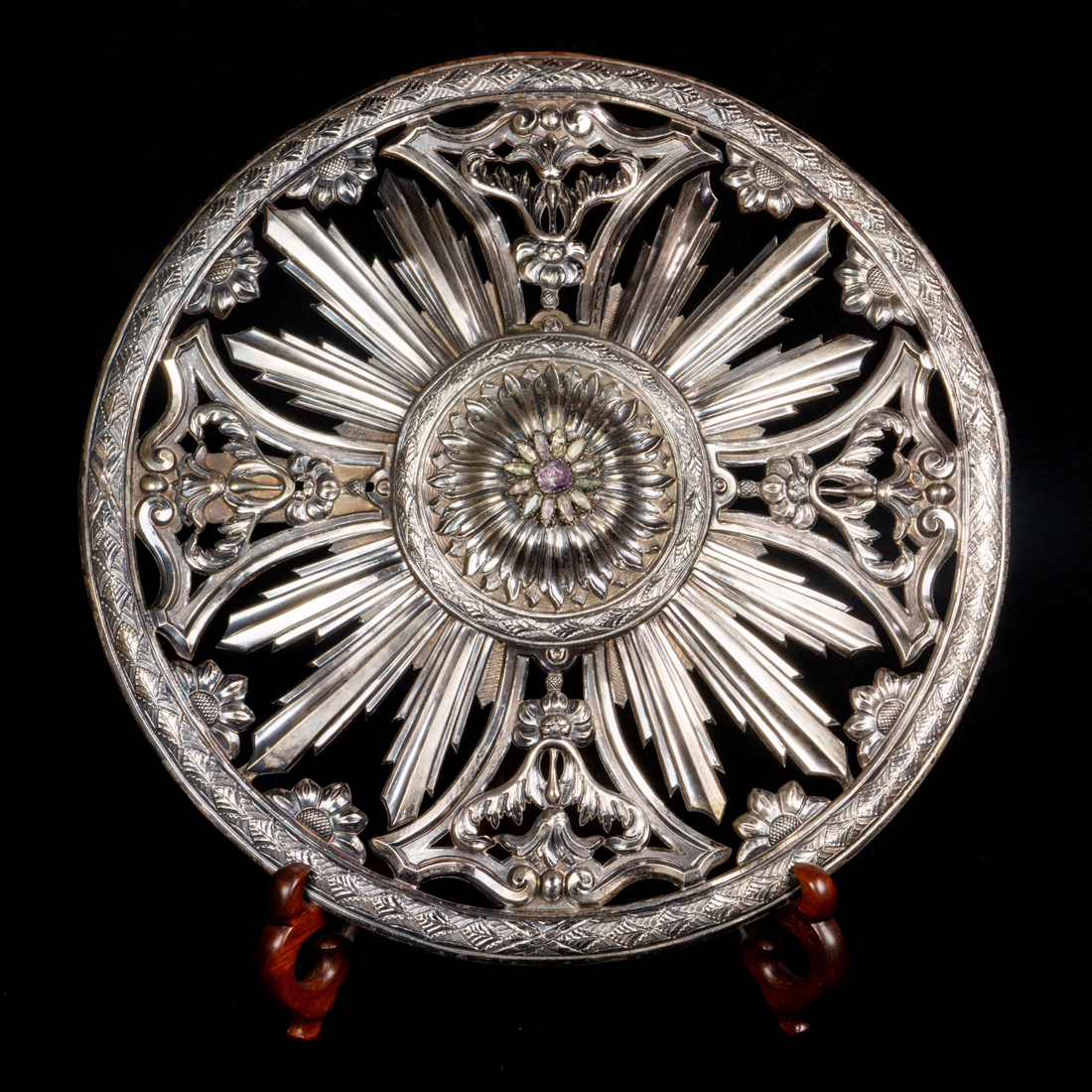 A JEWELED AND REPOUSSE SILVERED