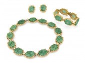 A Jomaz Goldtone and Jade Suit