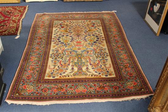 A Kashan rug with vase of flowers