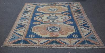 A Kazak carpet of geometric design,