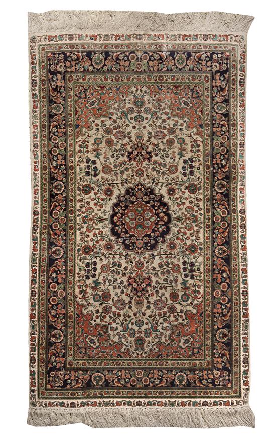 A Kirman Wool and Silk Rug centered