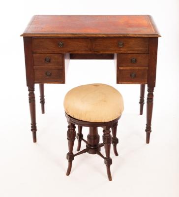 A kneehole writing table, fitted