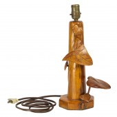 A KOA LAMP BASE CARVED WITH AN