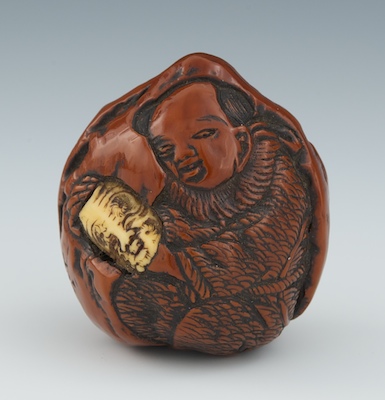 A Lacquered Peach Nut Netsuke
