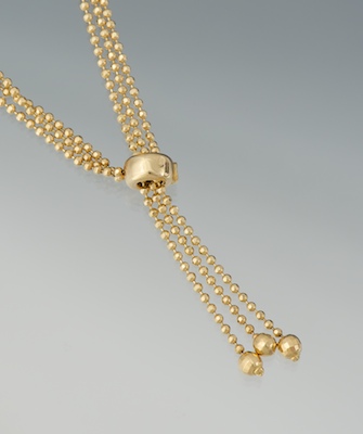 A Ladies' 14k Gold Bead Lariat
