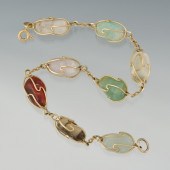 A Ladies' 18k Gold and Hardsto
