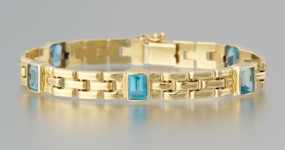 A Ladies' Blue Topaz and Gold