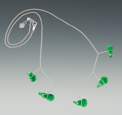 A Ladies' Carved Jadeite Gourds and