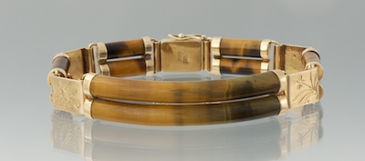 A Ladies' Carved Tiger Eye and Gold