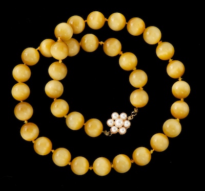 A Ladies' Cat's Eye Glass And Pearl