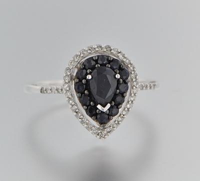 A Ladies' Diamond and Sapphire Ring