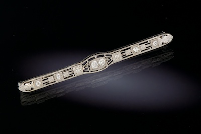 A Ladies' Diamond Filigree Brooch