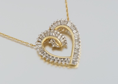 A Ladies' Diamond Heart Pendant 14k