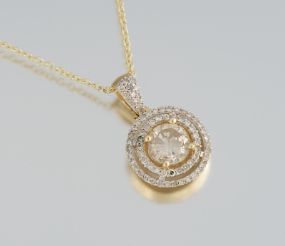 A Ladies' Diamond Pendant on