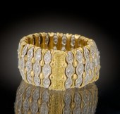 A Ladies' Flexible 18k Gold an