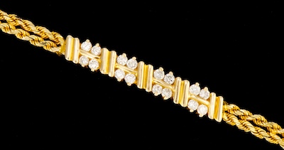 A Ladies' Gold and Diamond Bracelet