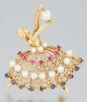 A Ladies' Gold Ballerina Brooc