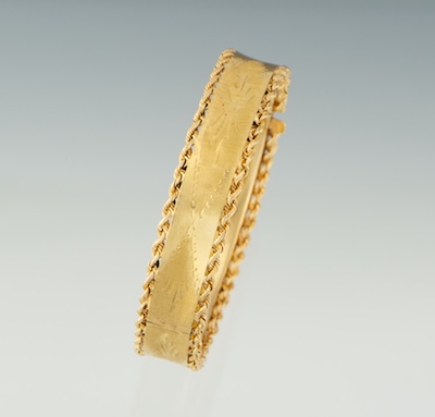 A Ladies' Gold Bangle Bracelet