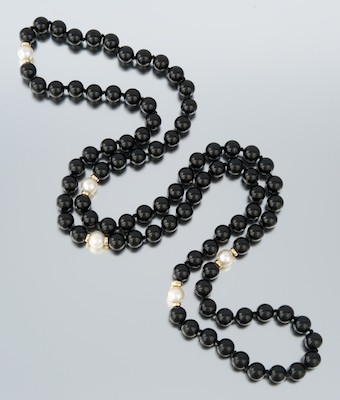 A Ladies' Onyx Pearl and Gold