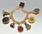 A Ladies' Watch Fob Charm Brac