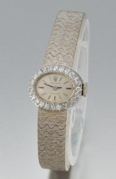 A Ladies' White Gold and Diamo