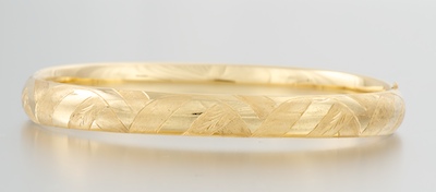 A Ladies' Yellow Gold Bangle