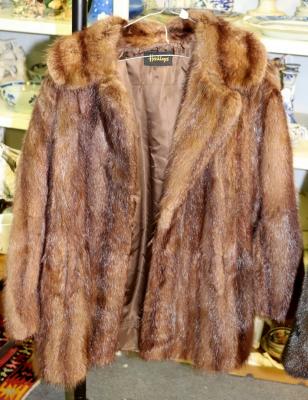 A lady's fur coat, label for