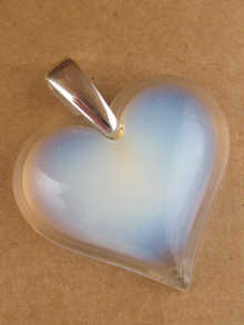 A Lalique heart shaped pendant with
