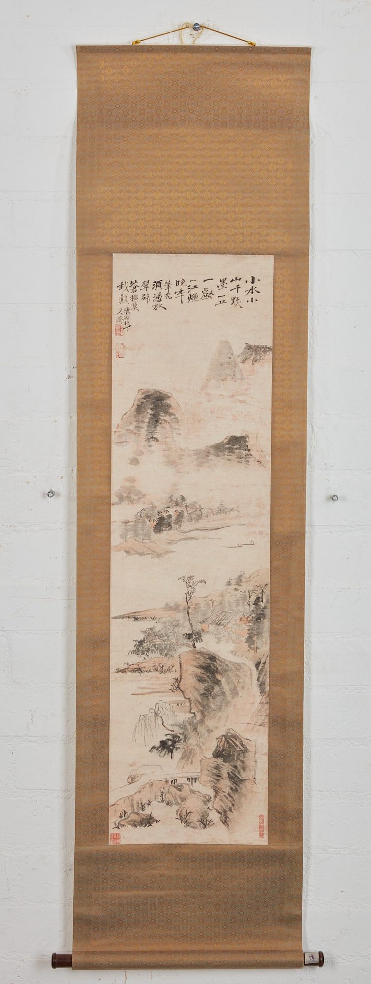A LANDSCAPE PAINTING HANGING