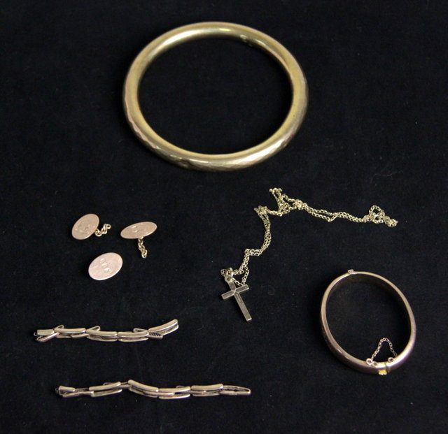A large 9ct gold bangle a 9ct