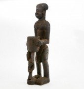 A LARGE AFRICAN WOOD FIGURE, B