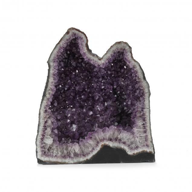 A LARGE AMETHYST DOME GEODE