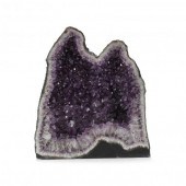 A LARGE AMETHYST DOME GEODE Br