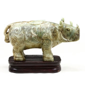 A LARGE ASIAN CARVED STONE RHI