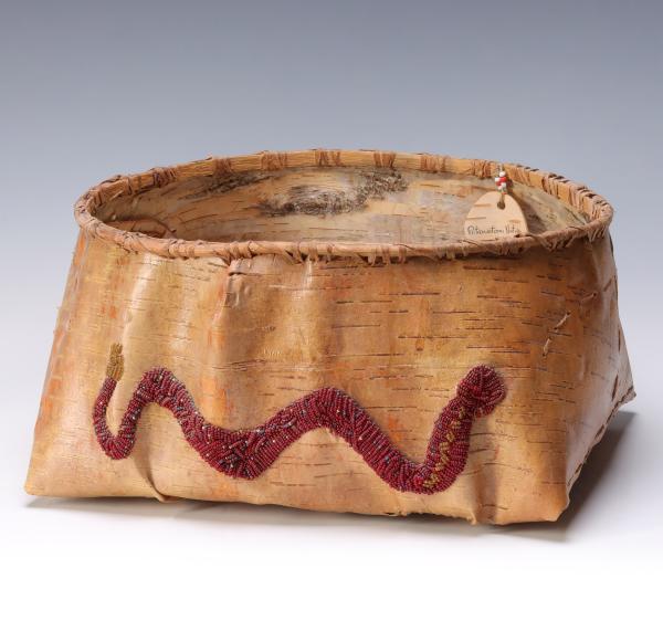A LARGE BIRCH BARK BASKET WITH